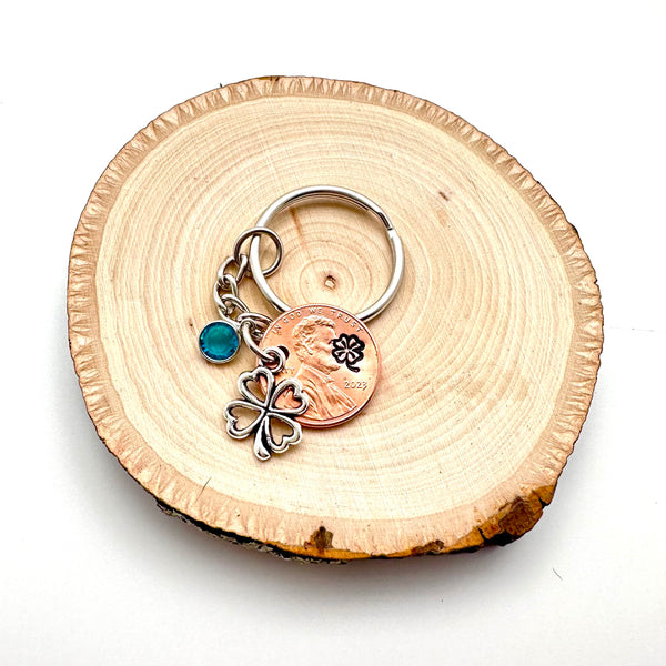 Birthstone keychain as a good luck gift with a clover charm and stamped clover on a penny.