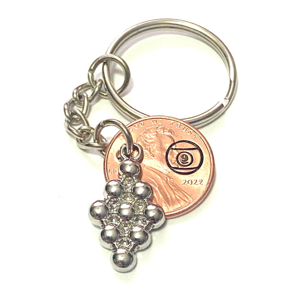 A silver 9 ball rack charm attached to a penny with a hand stamped billiard 9 ball on a 3” keychain.