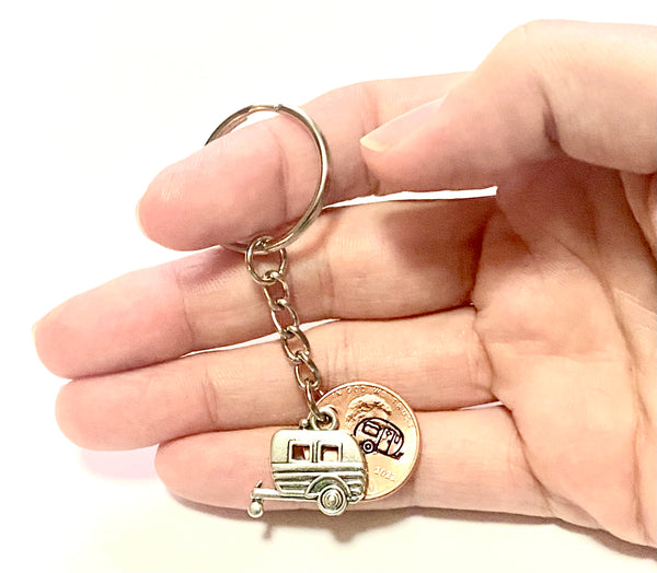 Our Camper Charm Lucky Penny Keychain features a hand stamped penny with a detailed camper trailer design engraved above the date.