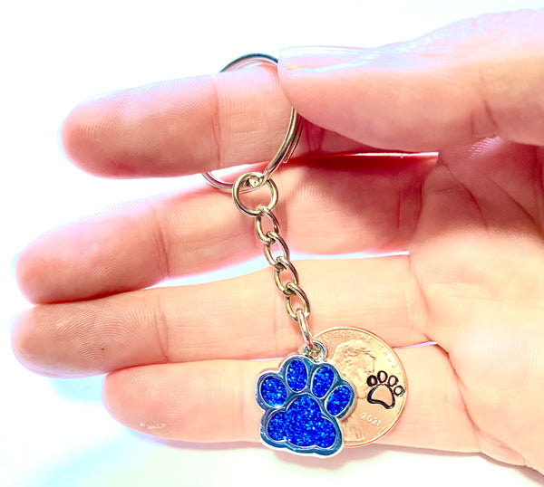 Blue Dog Paw Print Charm Lucky Penny Keychain with an engraved dog paw design above the date of a Lincoln Cent.