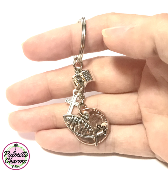 This Lucky Penny Keychain includes a Bible, Cross, and Jesus Fish Silver Charms. The Penny is hand stamped with a cross design.