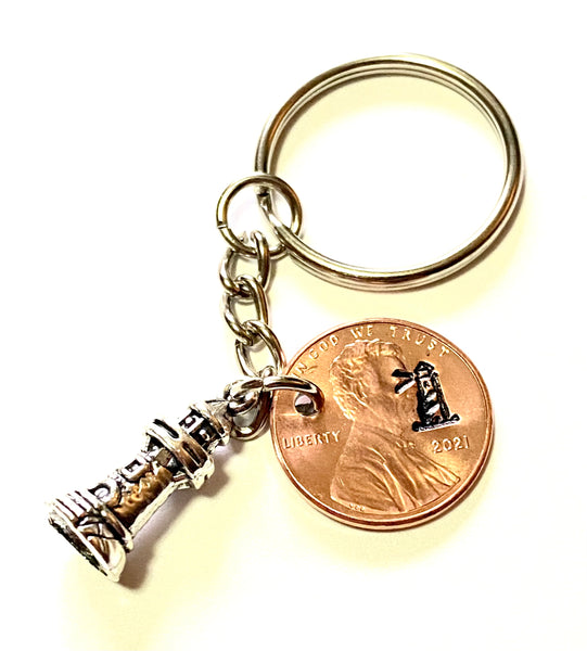 Silver Lighthouse Charm attached to a Lincoln Cent with an engraved lighthouse design above the date makes a great Lucky Penny Keychain gift!