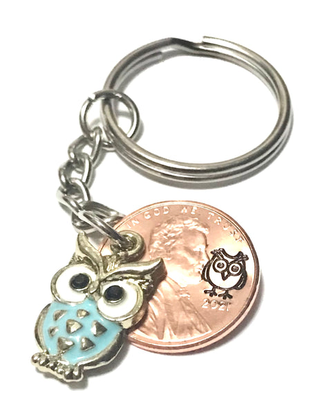 Blue Owl Charm on a Lucky Penny Keychain with an Owl engraving above the date of a Lincoln Cent.
