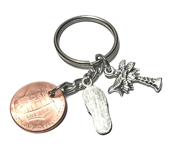 South Carolina Palmetto Tree with Crescent Moon Charm with a Silver Flip Flop Charm together with a Lincoln Cent engraved with the State outline above the date of a Lincoln Cent to make a Lucky Penny Keychain.