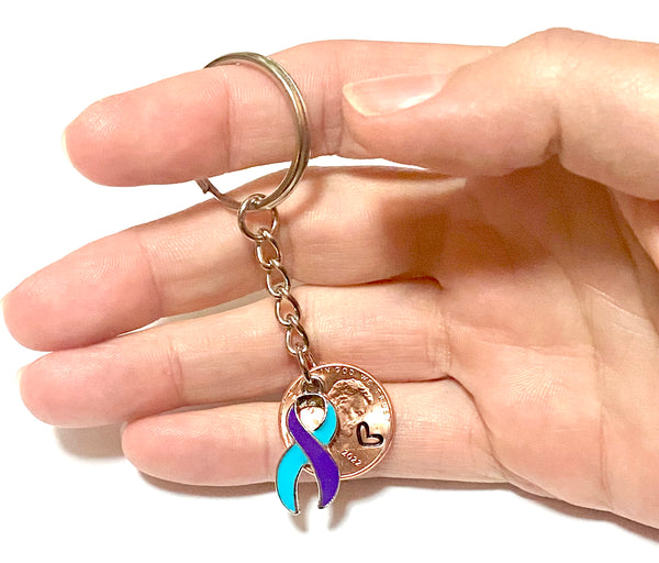 A full view of the suicide prevention awareness ribbon charm on a 3" keychain to help you find the right key fast.