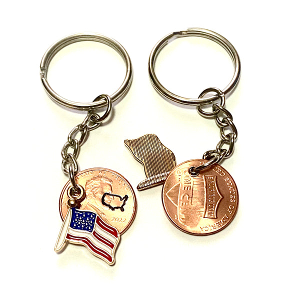 The US flag as an enamel charm on a zinc alloy base.