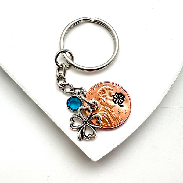 A Lucky Penny Keychain with silver clover charm and birthstone.