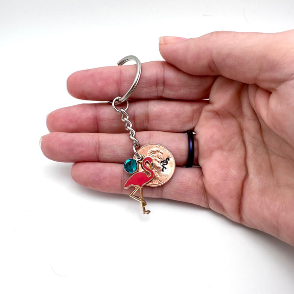 Gift for eclectic women is a lucky penny keychain with flamingos and birthstone.
