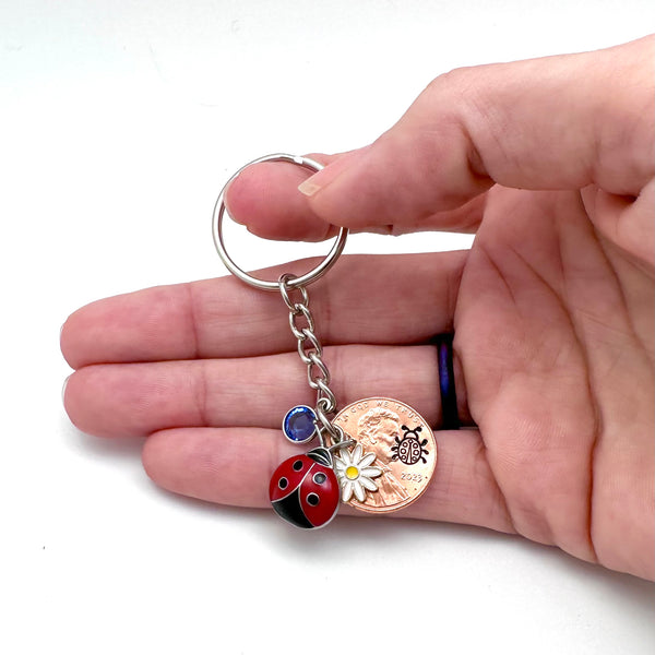 Birthstone keychain with ladybug charm and stamped penny.