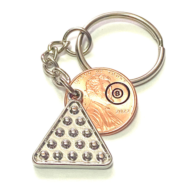 A silver 8 ball rack charm attached to a penny with a hand stamped billiard 8 ball on a 3” keychain.