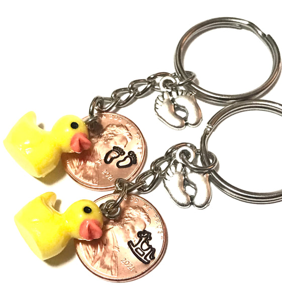Silver Baby Feet and Yellow Duck Charms on a Lucky Penny Keychain with choice of hand stamp engraved Baby Feet or Rocking Horse design on a Lincoln Cent.