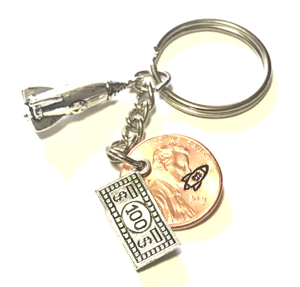 Bitcoin BTC Logo engraved on a Lucky Penny Keychain with a silver 100 charm and a To The Moon Rocket charm.