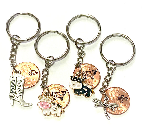 Four Lucky Penny Keychains by Palmetto Charms & Etc. that include hand stamped pennies with matching silver or enamel charms on a 3" keychain to help you find the right key fast!