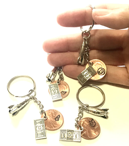 BTC, ETH, DOGE Engraved Lucky Penny Keychains with silver charms.
