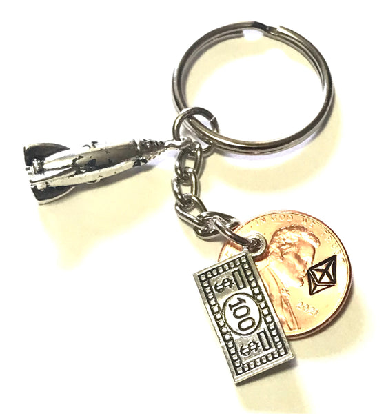 Ethereum Logo engraved on a Lucky Penny Keychain with a silver 100 charm and a To The Moon Rocket charm.