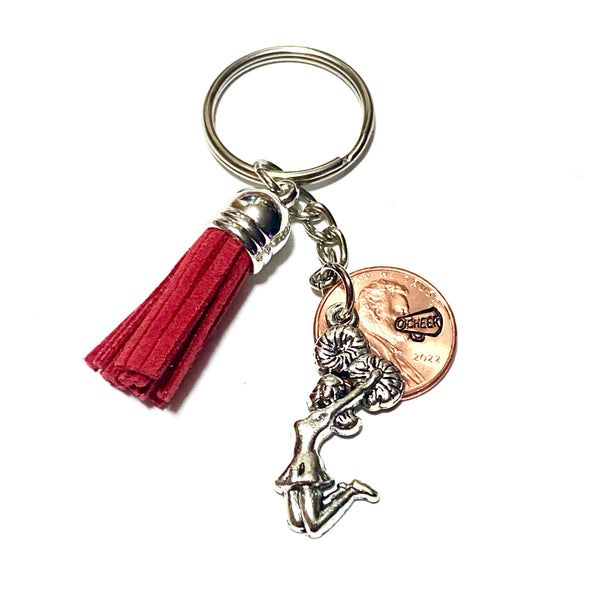 Show your school pride with this red tassel attached to a silver cheerleader charm on this Lucky Penny Keychain with a cheer megaphone design.