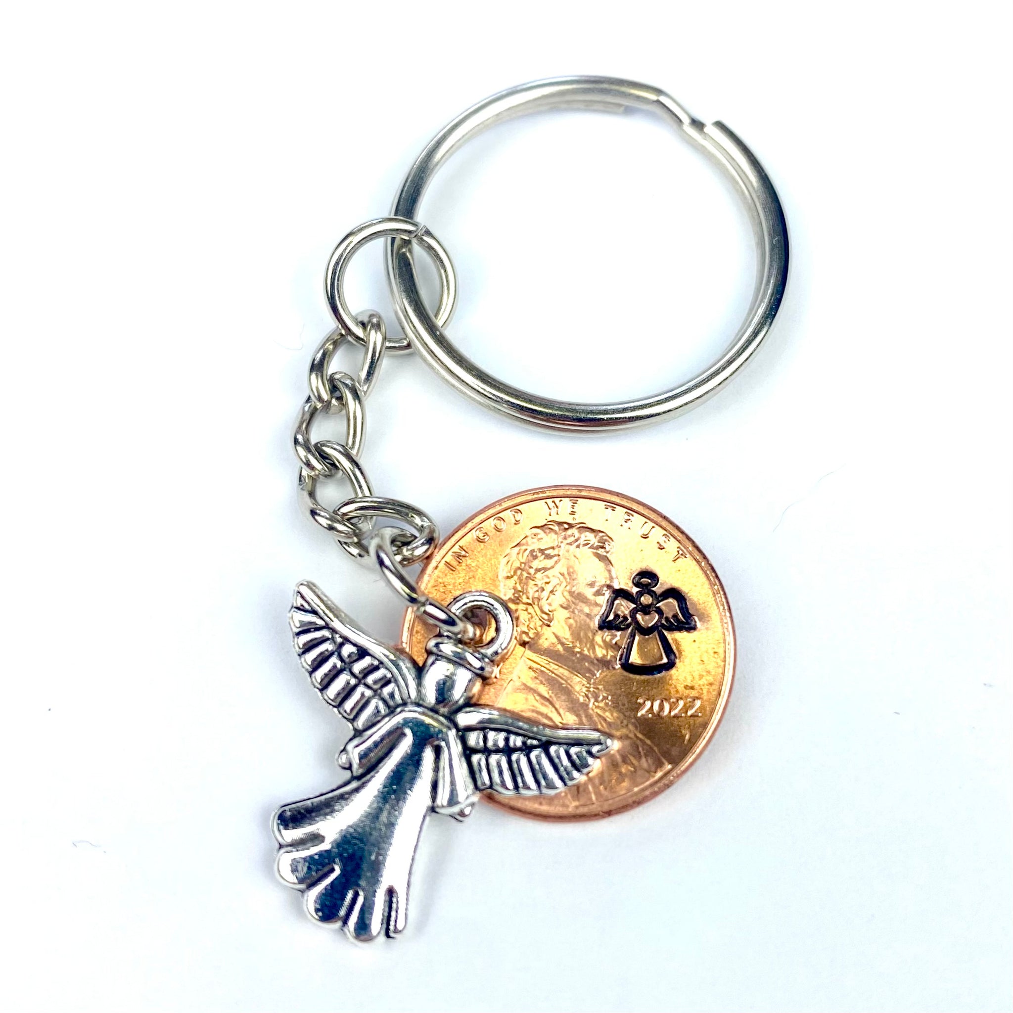Choose an Angel Lucky Penny Keychain to remember your loved one. The silver angel charm is perfect with the hand stamped angel on this penny.