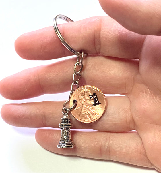 Silver Lighthouse Charm attached to a Lincoln Cent with an engraved lighthouse design above the date makes a great Lucky Penny Keychain gift!