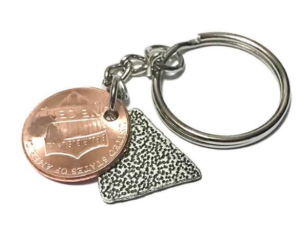 A Pizza Slice Silver Charm Lucky Penny Keychain with engraving of pizza slice above the date of a Lincoln Cent.