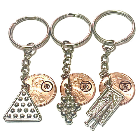Billiards Pro Lucky Penny Keychain have a handstamped pool ball on the penny and are attached to an 8 ball charm, 9 ball rack charm, or pool table charm.