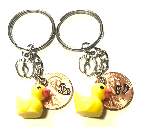 Silver Baby Feet and Yellow Duck Charms on a Lucky Penny Keychain with choice of hand stamp engraved Baby Feet or Rocking Horse design on a Lincoln Cent.