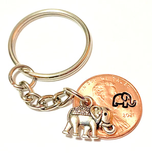 A Silver Elephant Charm attached to an engraved Lincoln Cent with a matching design above the date to make the perfect Lucky Penny Keychain.