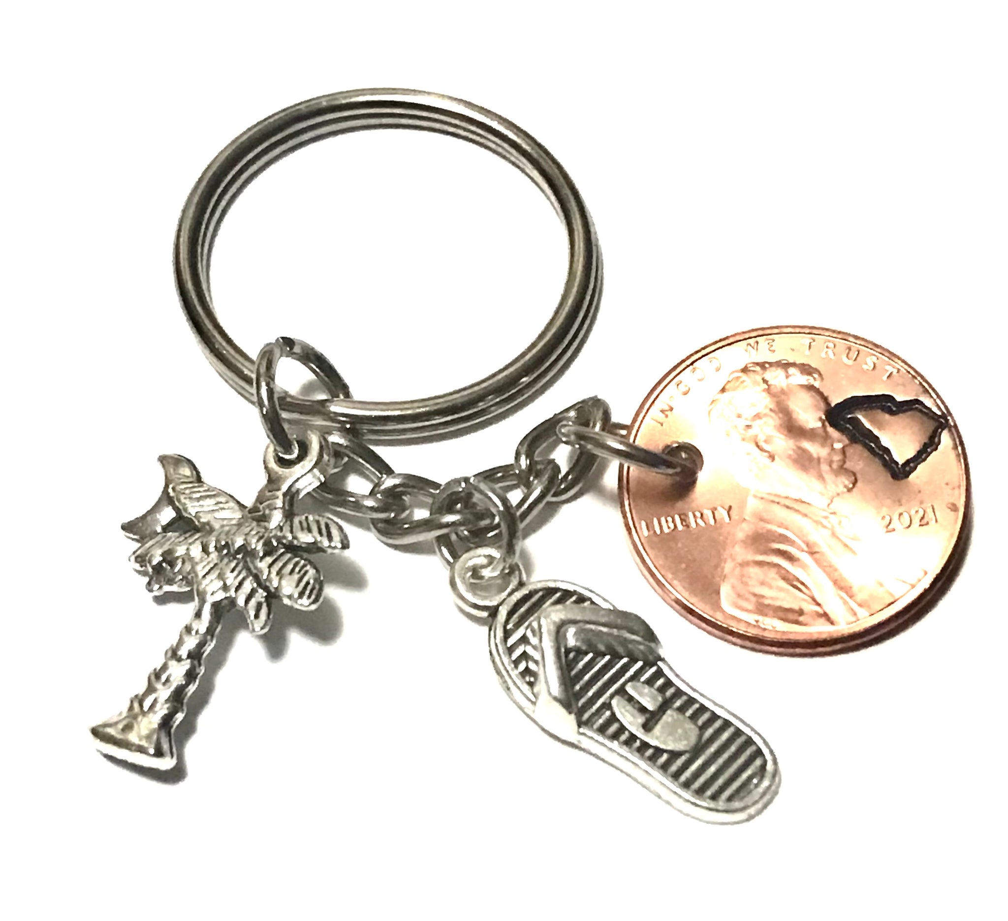 South Carolina Palmetto Tree with Crescent Moon Charm with a Silver Flip Flop Charm together with a Lincoln Cent engraved with the State outline above the date of a Lincoln Cent to make a Lucky Penny Keychain.