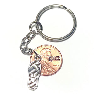 Sunglasses stamped penny attached to a silver flip flop charm on a 3" Lucky Penny Keychain makes the perfect gift for her.