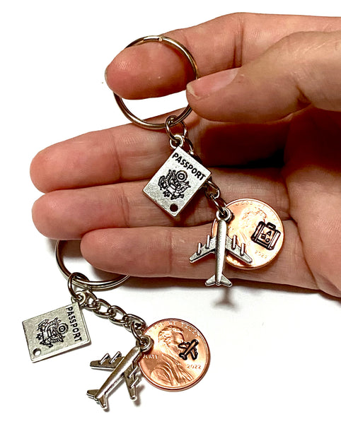 This gift for travelers is a Lucky Penny Keychain. It comes with a silver passport charm and silver airplane charm. We hand stamp your penny with a suitcase stamp or plane stamp.